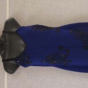 The Limited size small vintage blue & black dress 👗. 70% Acrylic 30% Wool